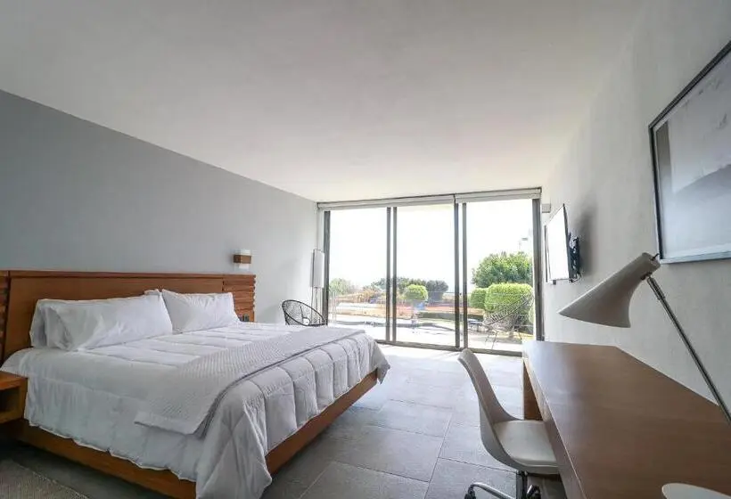 キングサイズベッドのデラックスルーム, Villa Internacional Hotel & Club