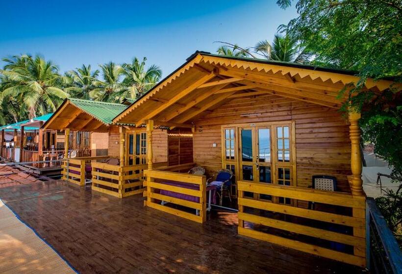 غرفة ديلوكس مطلّة علي البحر مزوَّدة بشُرفة, Om Sai Beach Huts
