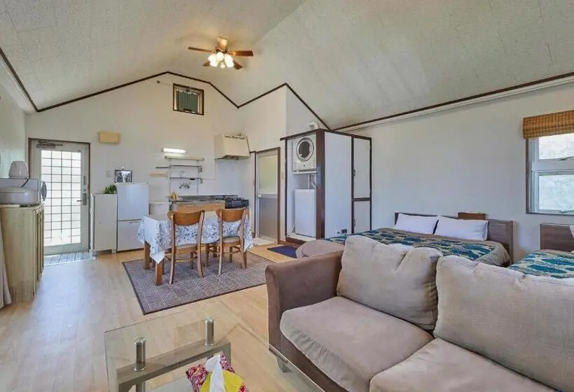Huoneisto 1 Makuuhuone Merinäkymä, Yukurina Resort Okinawa
