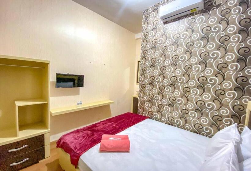 Номер Deluxe, Tini S Guest House Malang Mitra Reddoorz
