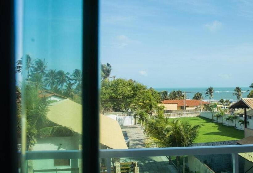 اتاق استاندارد چهار تخته با چشم‌انداز دریا, Coqueiro Village Flats