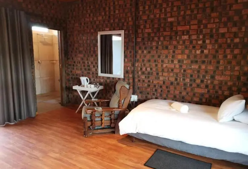 庭の見えるスタンダードトリプルルーム, En Route Guest House
