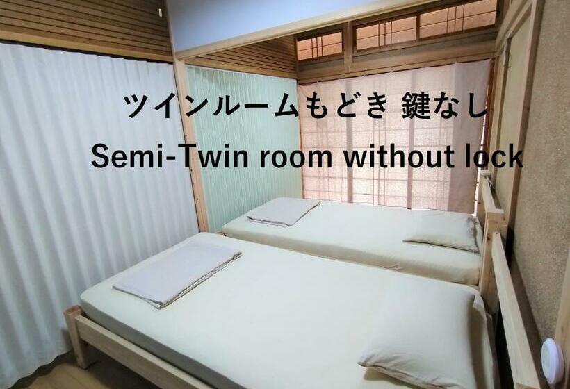 Ekonomiskt Rum, Guesthouse Tonari