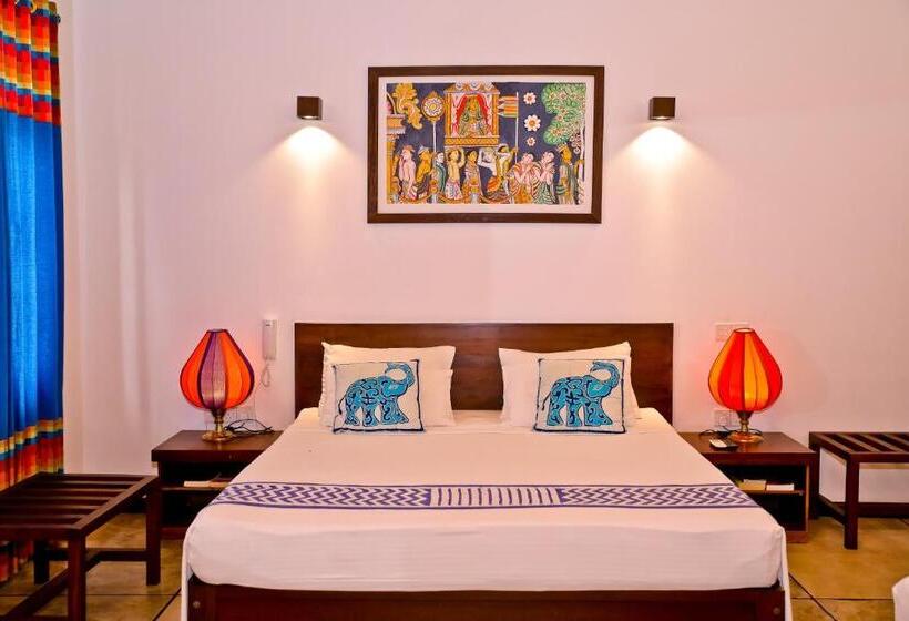 Camera Quadrupla Standard Vista Giardino, Blue Elephant Boutique