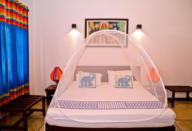 Camera Quadrupla Standard Vista Giardino, Blue Elephant Boutique