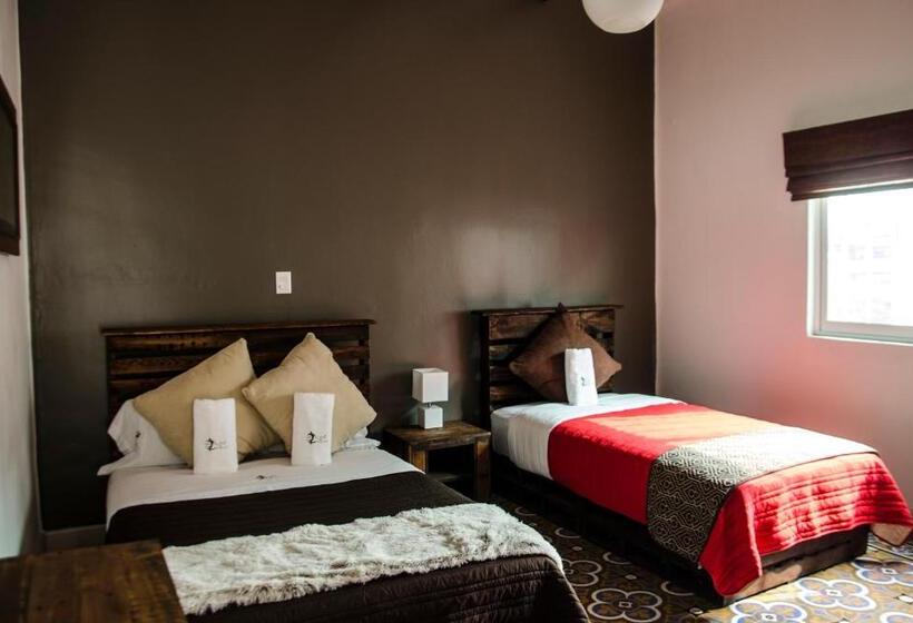 غرفة قياسية ثلاثية مطلة علي الحديقة, H1915 Hotel Boutique