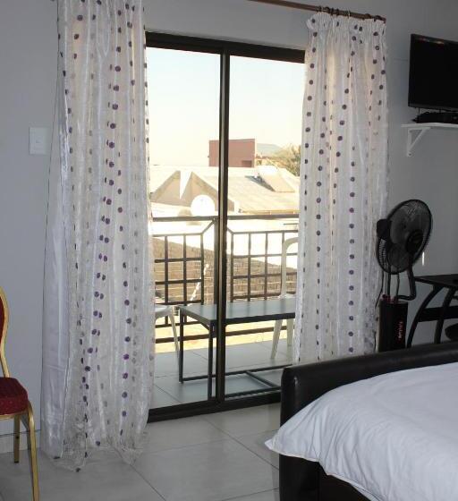 Quarto standart com varanda, Coco Palm Bed & Breakfast