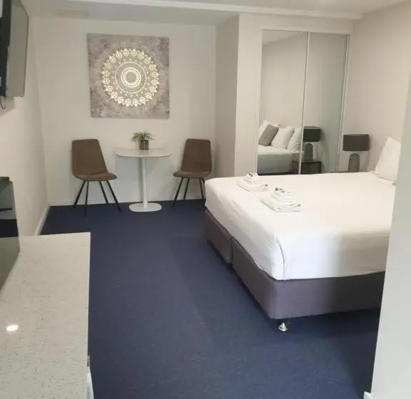キングサイズベッドのデラックスルーム, Carlton Suites