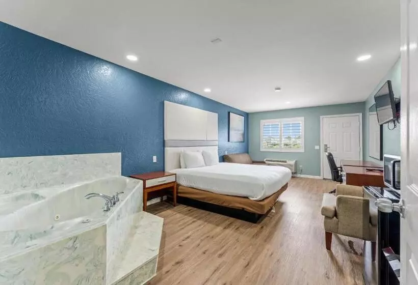 キングサイズベッドのスイートルーム, Executive Inn & Suites Magnolia