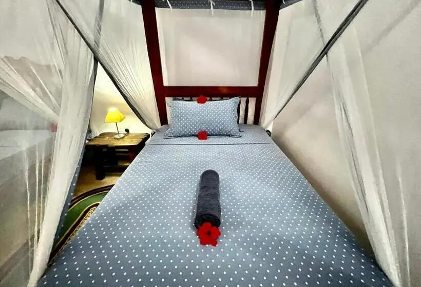 اتاق استاندارد سه تخته با چشمانداز باغ, Chikachika Beach B&b