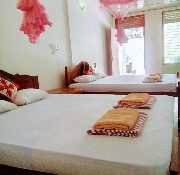اتاق خانوادگی با چشم‌انداز باغ, Margosa Guesthouse