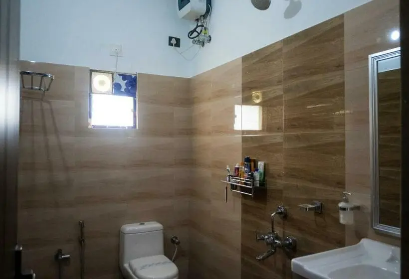 キングサイズベッドのデラックスルーム, Unique Shantiniketan