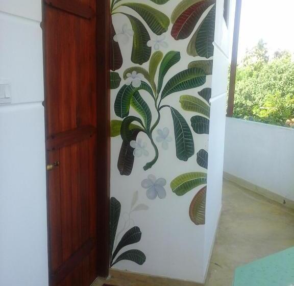 Quarto Deluxe Vista Mar, Peacock Wings Guest