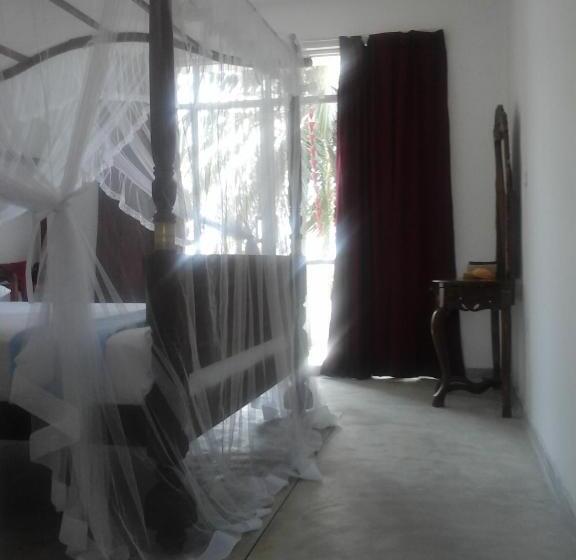 Quarto Deluxe Vista Mar, Peacock Wings Guest