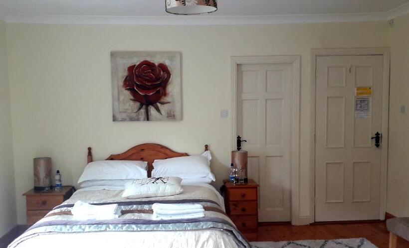 Quarto superior vista jardim, Newlands Lodge