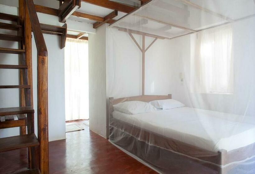 اتاق خانوادگی با چشمانداز دریا, Auberge De Grand Popo