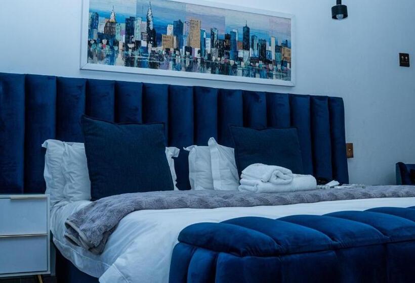 デラックススタジオ, Henry George Guest House