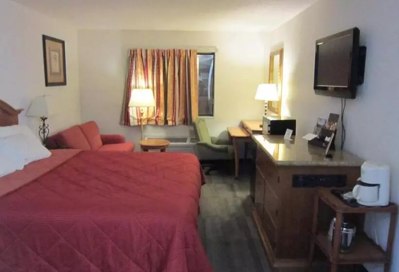 キングサイズベッドのスタンダードルーム, American Inn And Suites Ionia