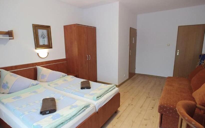 Quarto Quadruple Standart com Varanda, Riwiera Dźwirzyno