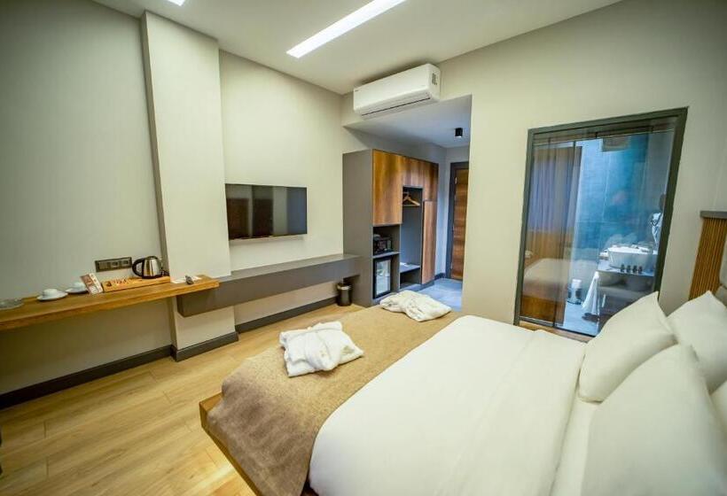 Quarto standart vista jardim, Aksular