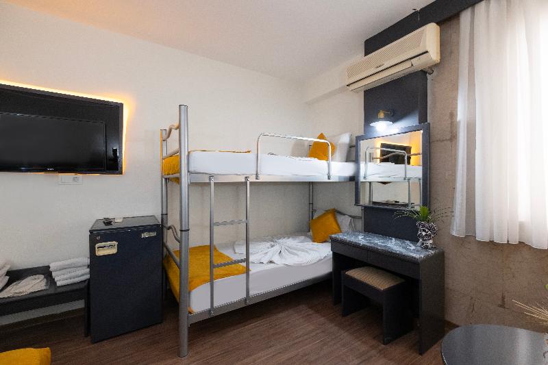 Quarto Quádruplo Standard, Güleryüz 2