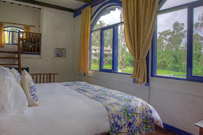 غرفة ديلوكس عائلية, Hostería Hacienda Pinsaqui