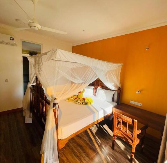 חדר דלוקס לשלושה עם נו לים, Villa Vanilla Kendwa