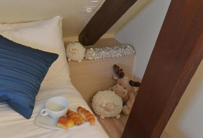 غرفة عائلية, Hôtel De La Plage