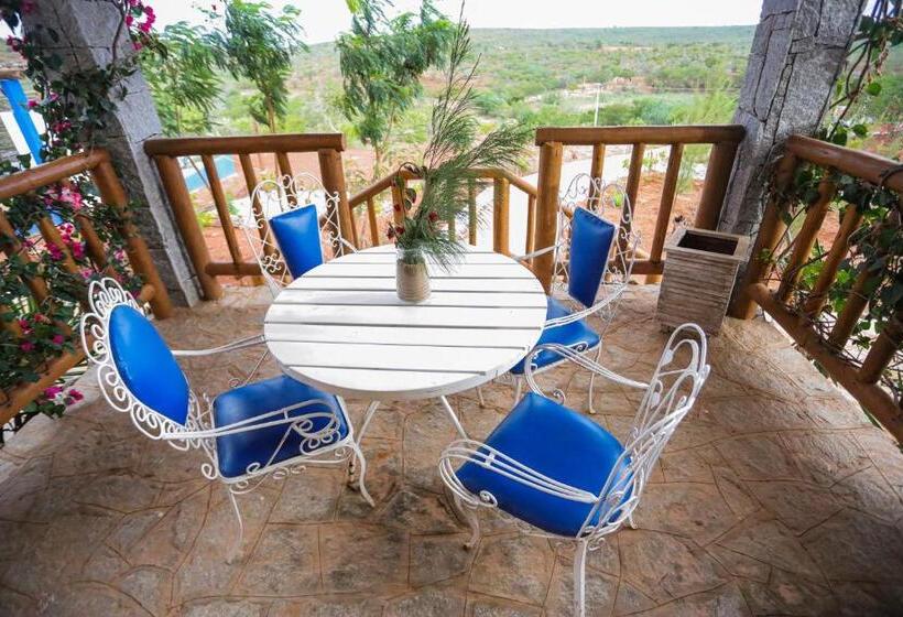 מיטת קינג בסוויטה, Pousada Matuto Sonhador