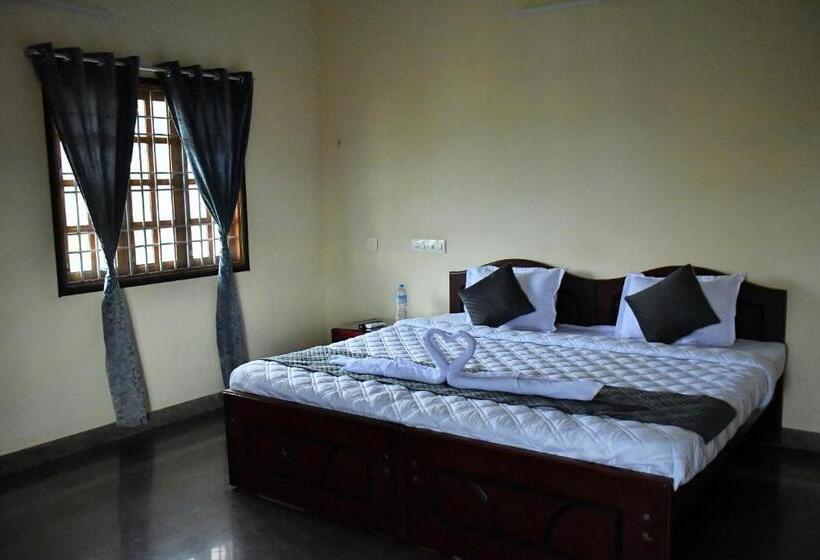 Quarto Deluxe, Revive Inn Pondy   Rooms & Villa