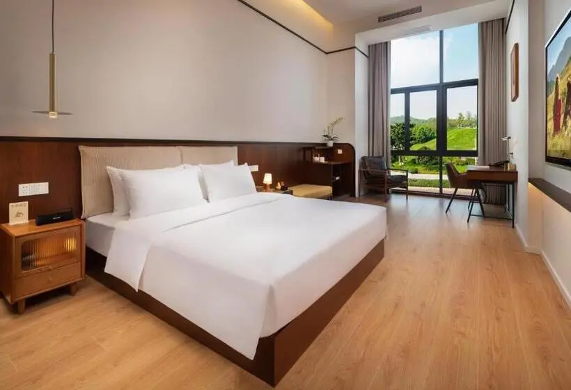 キングサイズベッドのデラックスルーム, Wuyu Hotel, Smart Park & Happy Valley Jinshansi Metro