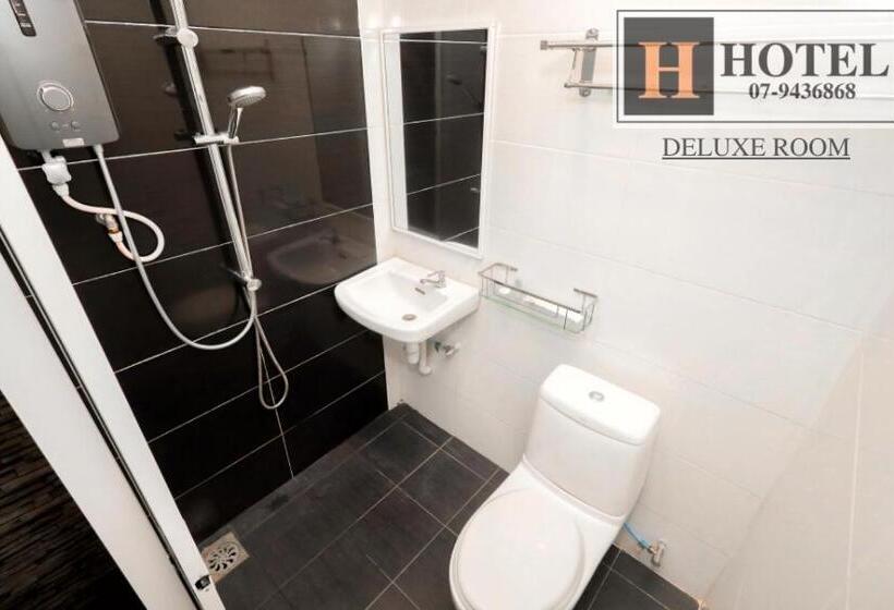 חדר דלוקס, H