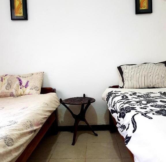 اتاق یک تخته با چشم‌انداز باغ, Chinyonga Guesthouse
