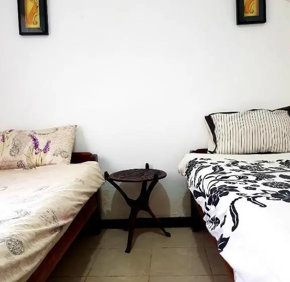 اتاق یک تخته با چشم‌انداز باغ, Chinyonga Guesthouse