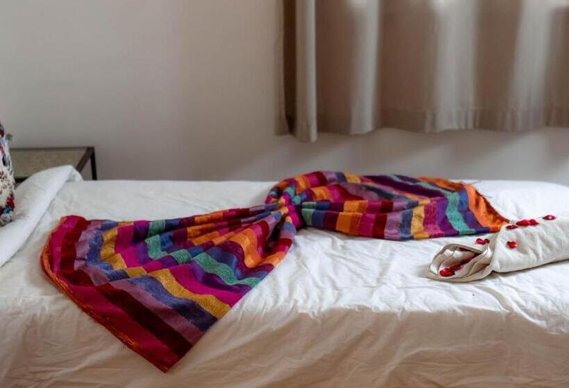 חדר סטנדרט לשלושה עם נוף לגינה, L Oasis Du Bonheur