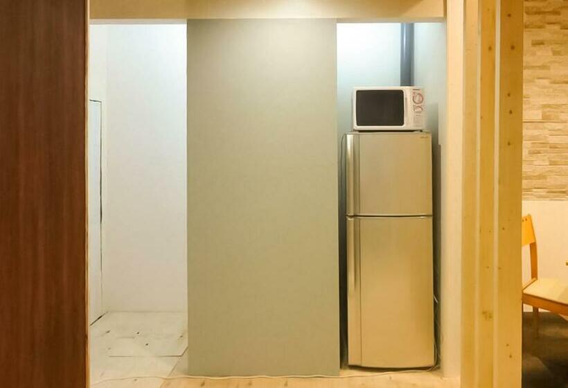 Кровать в Общей Комнате, Relak Guest House 登別 Station