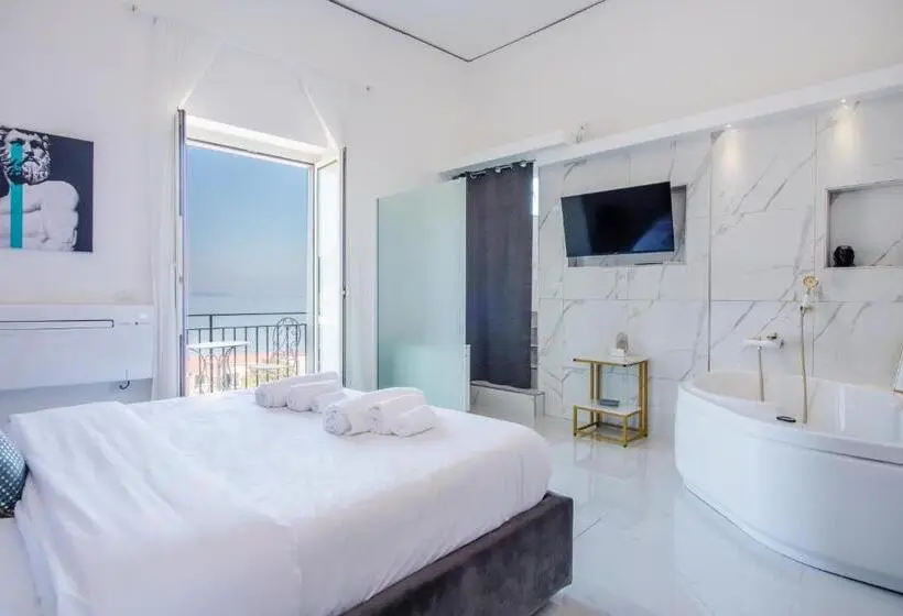 キングサイズベッドのスタンダードルーム, Naro Suites And Rooms