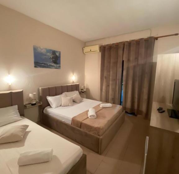 חדר סטנדרט לשלושה עם נוף לגינה, Seashell Beach Rooms