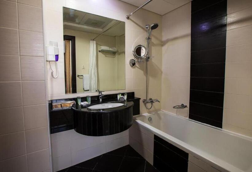 キングサイズベッドのデラックススイート, Grand Villaggio Hotel Abu Dhabi