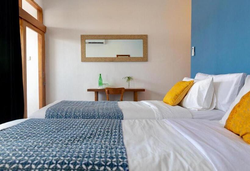 Quarto Triplo Standart Vista Mar Lateral, Pesona Beach Resort & Spa