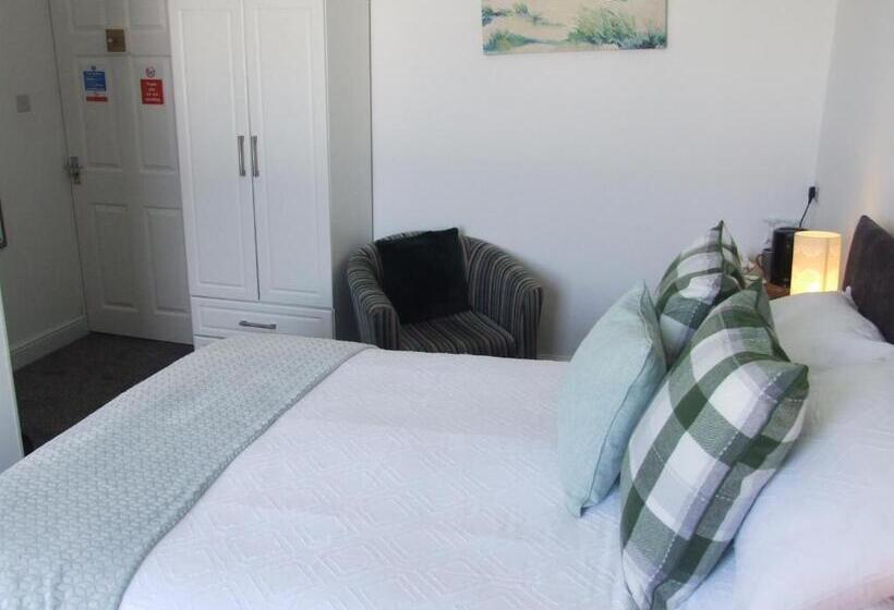 キングサイズベッドのデラックスルーム, Coach Guest House