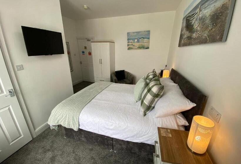 キングサイズベッドのデラックスルーム, Coach Guest House