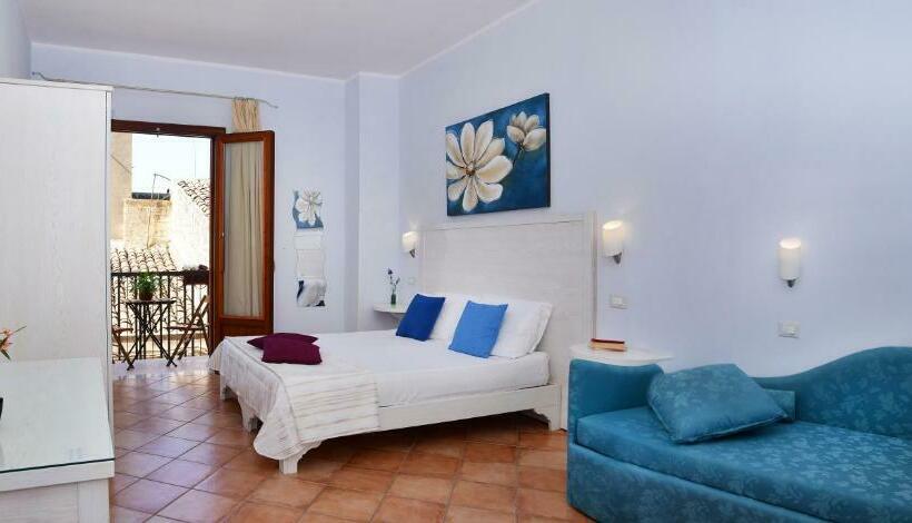 Quarto Quadruple Standart com Varanda, Badia Rooms & Breakfast