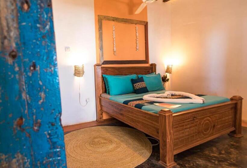 اتاق استاندارد سه تخته با چشم‌انداز باغ, Pili Pili Beach Bungalows