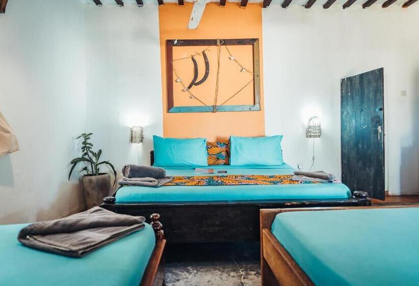 اتاق استاندارد چهارنفره با چشم‌انداز باغ, Pili Pili Beach Bungalows