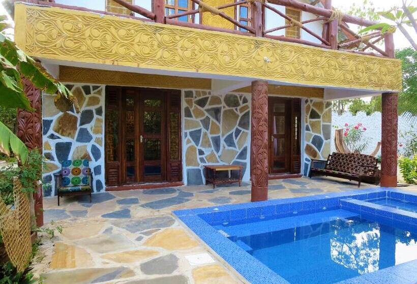 庭の見えるスタンダードトリプルルーム, Queen Of Sheba Beach Lodge