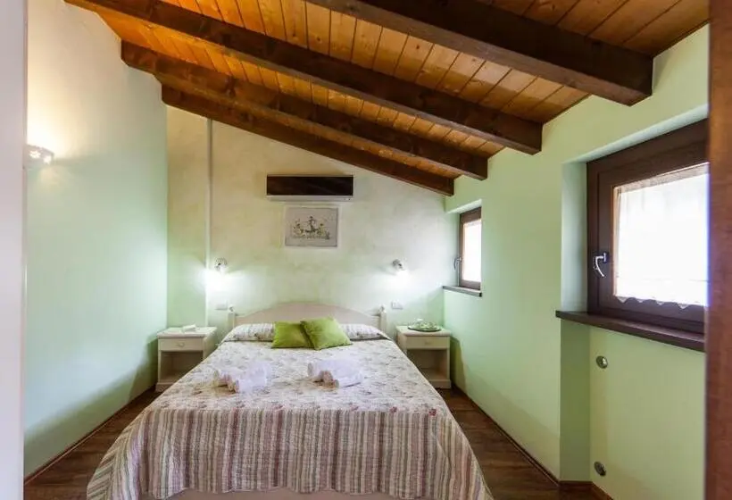 Huoneisto 1 Makuuhuone Puutarhanäkymä, Agriturismo Alla Poncia