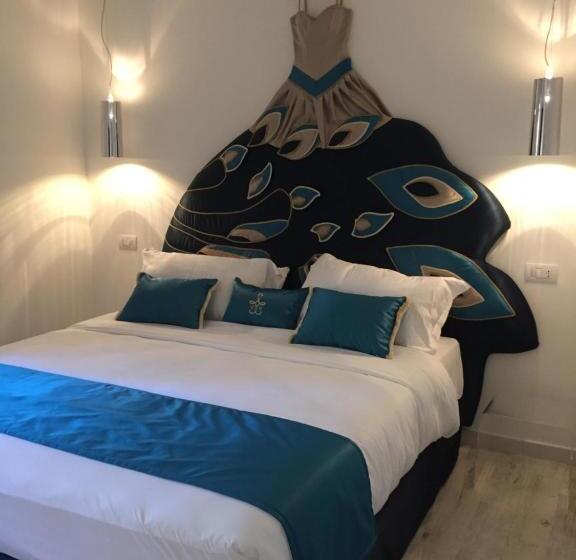 מיטת קינג בסוויטה, Geco Di Giada Art Suites   Adult Only