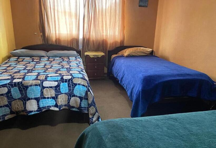 חדר סטנדרטי לארבעה עם חדר אמבטיה משותף, Hostal Pachamama Lodge