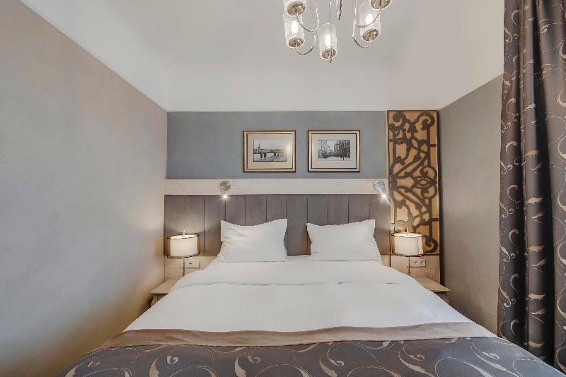 Quarto deluxe, Metropole Hotel By Semarah
